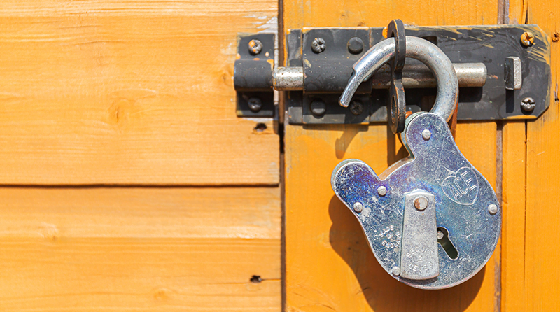 A door with a padlock open representing whitelist attack