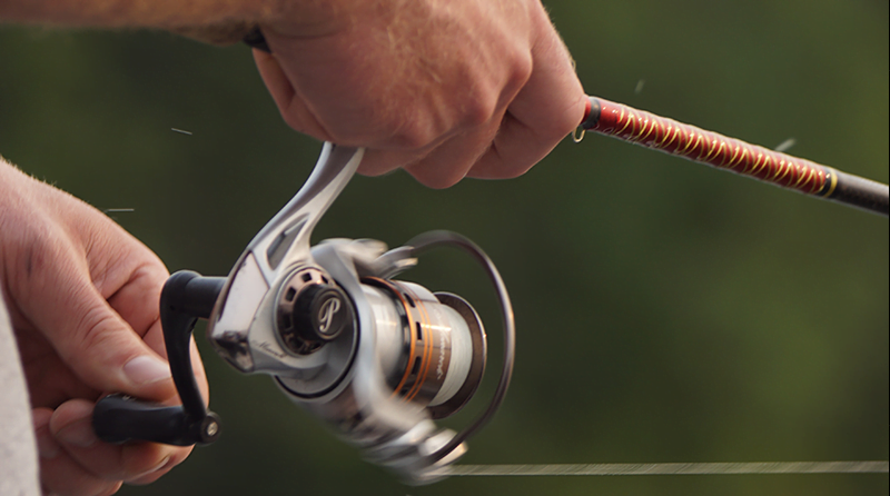 Man holding a fishing real representing threat hunting