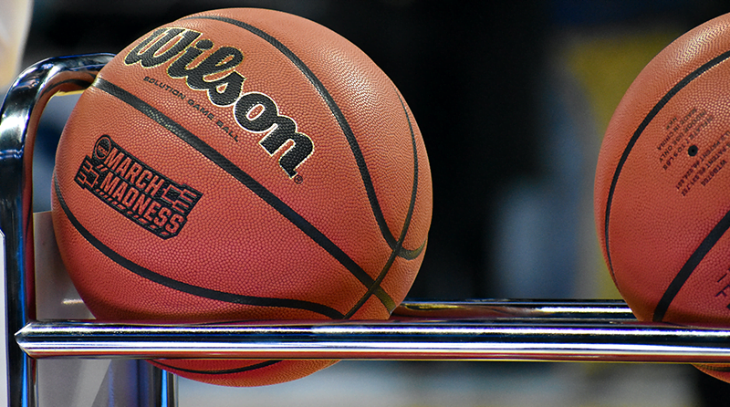 Basketballs on a rack representing api security and March Madness